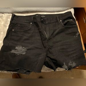 Distressed black jean shorts